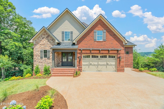 1100 Regality Way, Knoxville, TN 37923 - view of front of property with driveway, a garage, french doors, stone siding, and a front yard