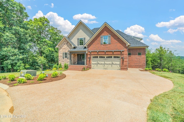 1100 Regality Way, Knoxville, TN 37923 - view of front of home featuring concrete driveway, an attached garage, brick siding, and roof with shingles