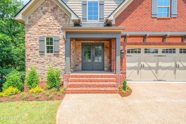 1100 Regality Way, Knoxville, TN 37923 - view of exterior entry featuring french doors, driveway, brick siding, and stone siding
