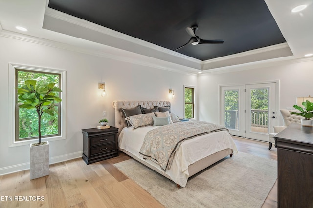 1100 Regality Way, Knoxville, TN 37923 - bedroom with a tray ceiling, multiple windows, access to outside, ornamental molding, and recessed lighting
