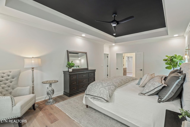 1100 Regality Way, Knoxville, TN 37923 - bedroom featuring a raised ceiling, light wood-type flooring, ornamental molding, recessed lighting, and a ceiling fan