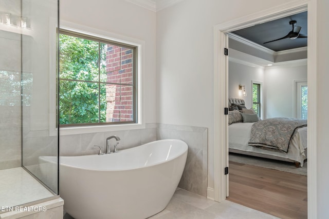 1100 Regality Way, Knoxville, TN 37923 - bathroom featuring ensuite bath, ornamental molding, a soaking tub, and tile walls