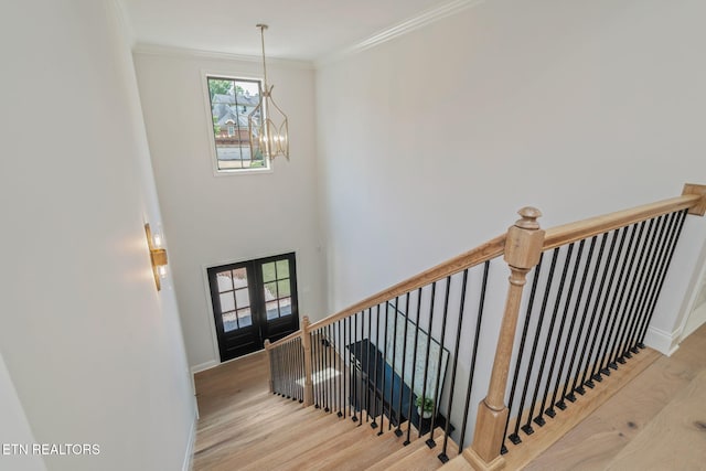 1100 Regality Way, Knoxville, TN 37923 - stairs with a chandelier, wood finished floors, and crown molding