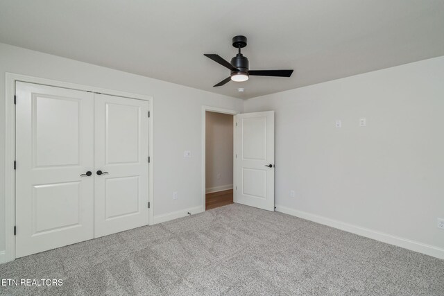 1100 Regality Way, Knoxville, TN 37923 - unfurnished bedroom with carpet, a closet, and a ceiling fan