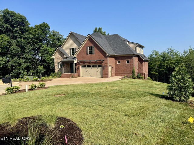 1100 Regality Way, Knoxville, TN 37923 - view of front of house featuring an attached garage, concrete driveway, a front yard, and brick siding