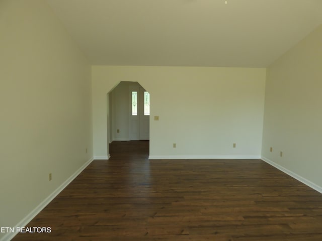 363 Smith Rd, Crossville, TN 38571 - spare room featuring dark wood-type flooring and arched walkways