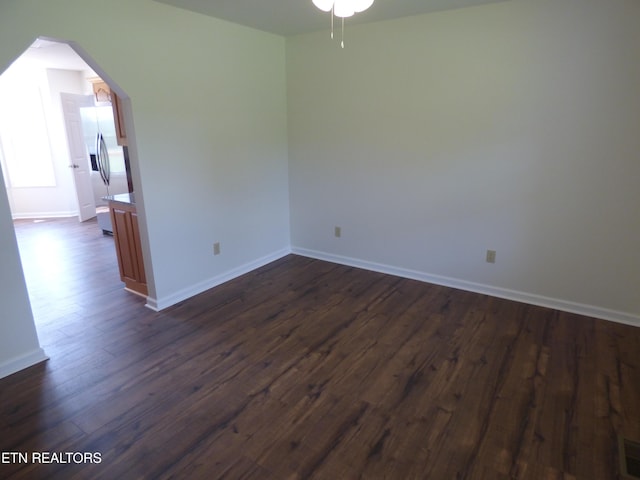 363 Smith Rd, Crossville, TN 38571 - spare room featuring ceiling fan, dark wood-style floors, and arched walkways