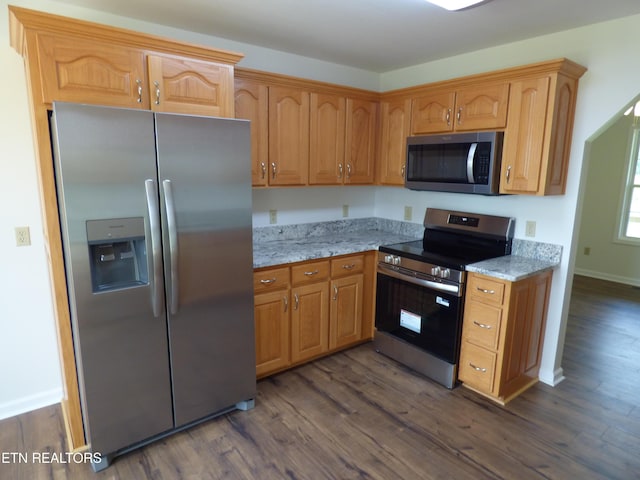 363 Smith Rd, Crossville, TN 38571 - kitchen with stainless steel appliances, dark wood-type flooring, and light stone counters