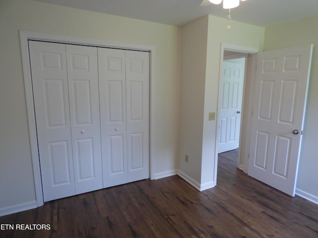 363 Smith Rd, Crossville, TN 38571 - unfurnished bedroom with dark wood-type flooring, a closet, and a ceiling fan