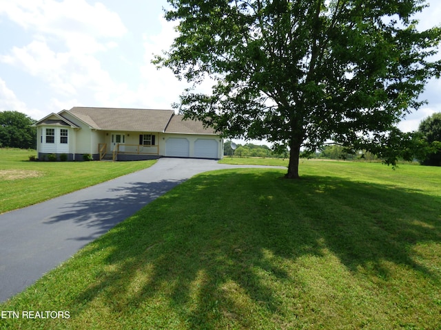 363 Smith Rd, Crossville, TN 38571 - ranch-style house featuring a garage, asphalt driveway, and a front yard