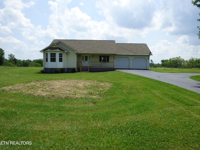 363 Smith Rd, Crossville, TN 38571 - single story home with driveway, a garage, a front yard, covered porch, and a shingled roof