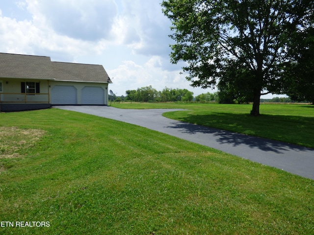 363 Smith Rd, Crossville, TN 38571 - view of grassy yard with driveway and a garage