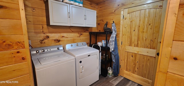 1955 Terry Rd, Oneida, TN 37841 - laundry area with cabinet space, independent washer and dryer, wooden walls, and dark wood-style floors