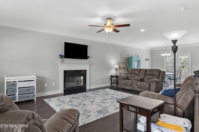 1152 Cloud View Dr, Powell, TN 37849 - living room featuring a ceiling fan, dark wood-style flooring, a chandelier, a fireplace with flush hearth, and ornamental molding