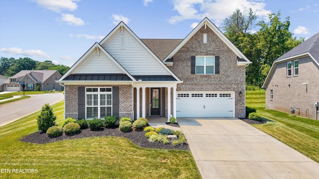 12845 Scarlet Sage Dr, Farragut, TN 37934 - craftsman-style house with brick siding, a standing seam roof, a front lawn, driveway, and a garage