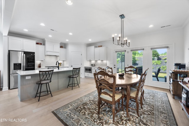 12845 Scarlet Sage Dr, Farragut, TN 37934 - dining room featuring crown molding, light wood-type flooring, recessed lighting, and a chandelier