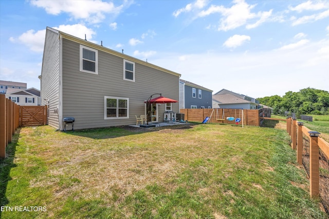 1171 Hampton Place Cir, Loudon, TN 37774 - back of property featuring a patio and a fenced backyard