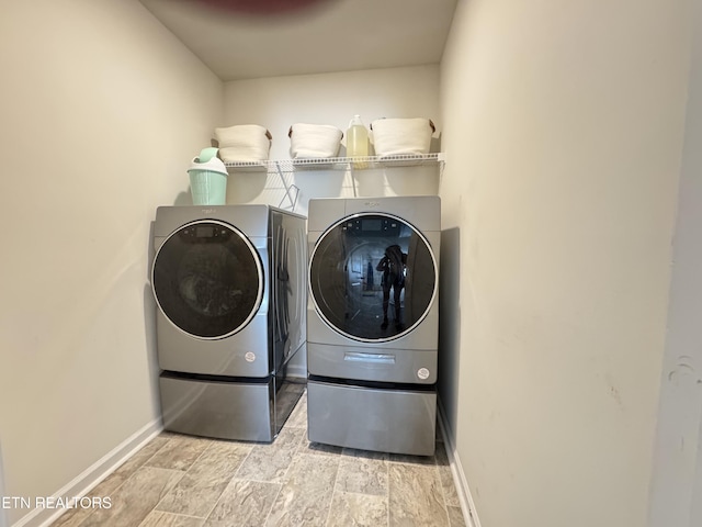1171 Hampton Place Cir, Loudon, TN 37774 - laundry room featuring washing machine and clothes dryer and light stone finish flooring