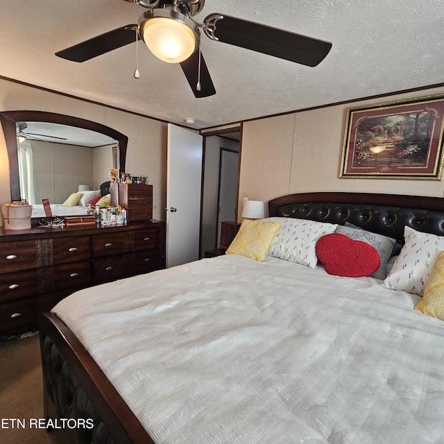 1911 Branam Hill Rd, Jellico, TN 37762 - carpeted bedroom with arched walkways and a ceiling fan