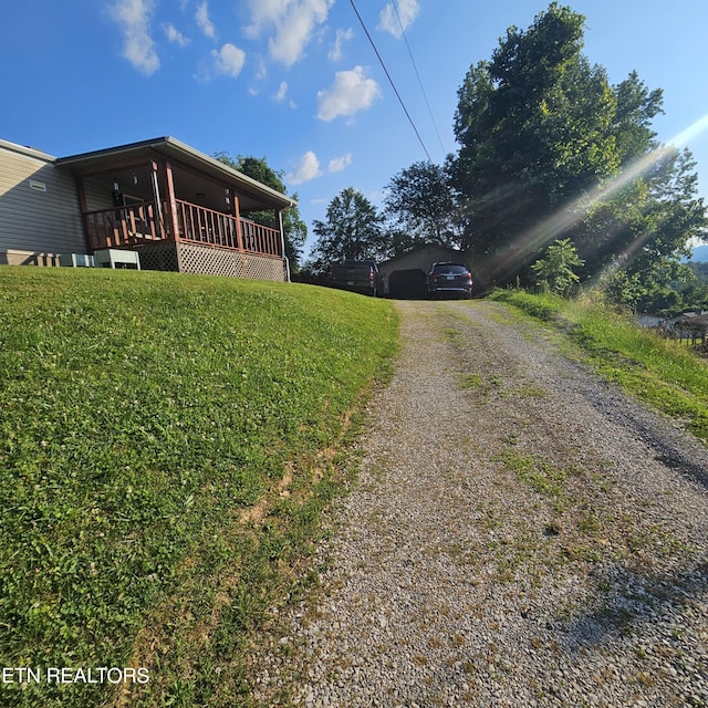 1911 Branam Hill Rd, Jellico, TN 37762 - view of property exterior with dirt driveway and a lawn