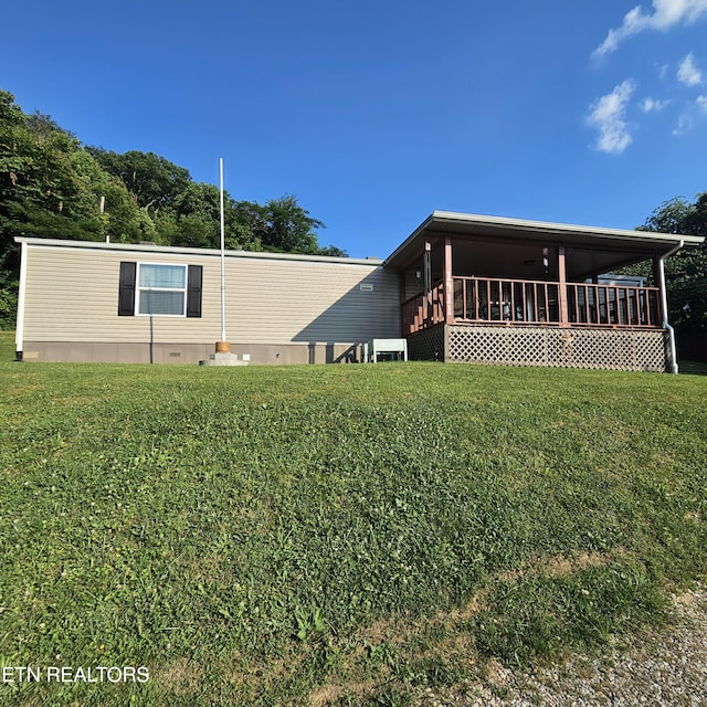 1911 Branam Hill Rd, Jellico, TN 37762 - view of side of home with a lawn
