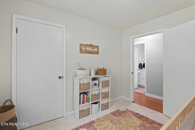 382 Tionesta Dr, Jacksboro, TN 37757 - carpeted bedroom with a textured ceiling and baseboards