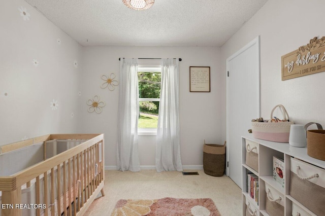 382 Tionesta Dr, Jacksboro, TN 37757 - bedroom featuring a nursery area, carpet, and a textured ceiling