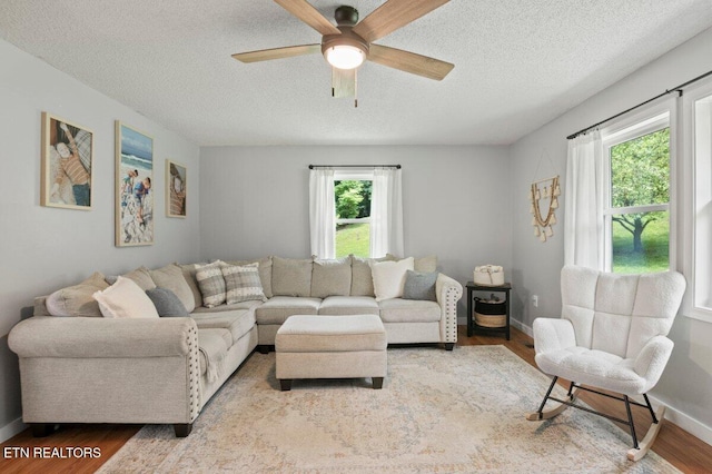 382 Tionesta Dr, Jacksboro, TN 37757 - living room featuring a textured ceiling, plenty of natural light, wood finished floors, and a ceiling fan