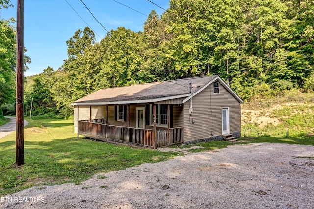 163 Ridge Rd, Sharps Chapel, TN 37866 - view of front facade featuring a front lawn, a porch, entry steps, roof with shingles, and a view of trees