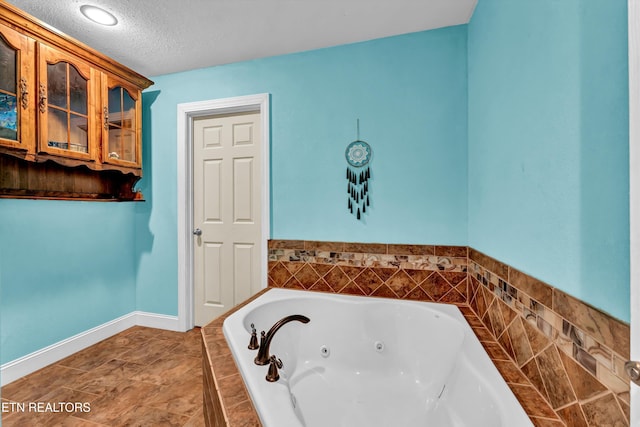 163 Ridge Rd, Sharps Chapel, TN 37866 - full bathroom featuring a whirlpool tub and a textured ceiling