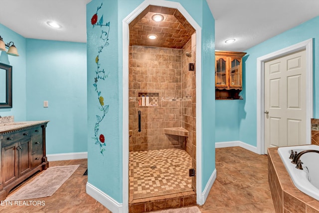 163 Ridge Rd, Sharps Chapel, TN 37866 - bathroom with a stall shower, a garden tub, vanity, and recessed lighting