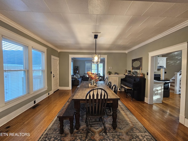2824 W Cumberland Ave, Middlesboro, KY 40965 - dining room with hardwood / wood-style flooring and crown molding