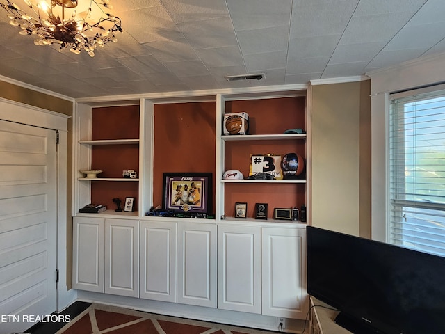 2824 W Cumberland Ave, Middlesboro, KY 40965 - detailed view of built in shelves, crown molding, and a chandelier