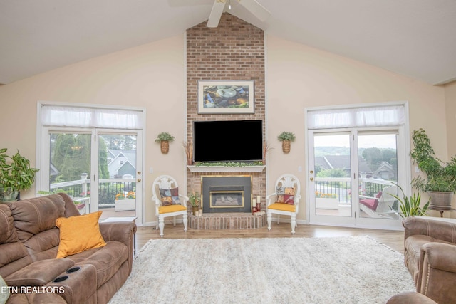 127 Kiowa Way, Loudon, TN 37774 - living room with a fireplace, ceiling fan, wood finished floors, high vaulted ceiling, and beam ceiling