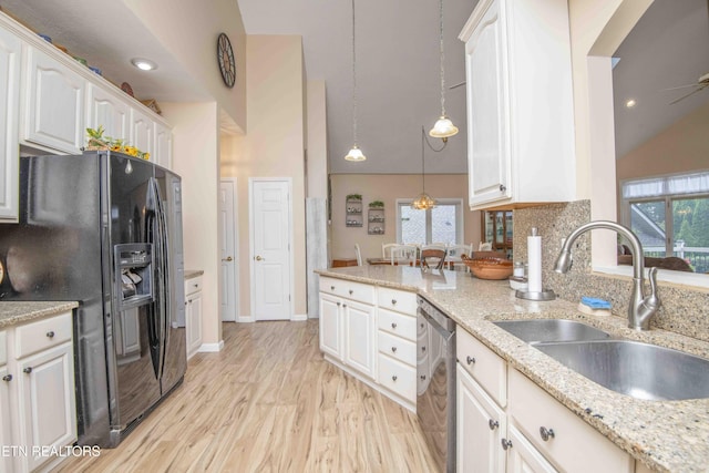 127 Kiowa Way, Loudon, TN 37774 - kitchen featuring black fridge, dishwasher, white cabinets, pendant lighting, and high vaulted ceiling