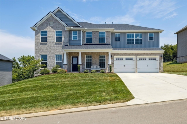 1682 Hickory Reserve Rd, Knoxville, TN 37932 - craftsman-style house with a garage, a front yard, concrete driveway, board and batten siding, and brick siding