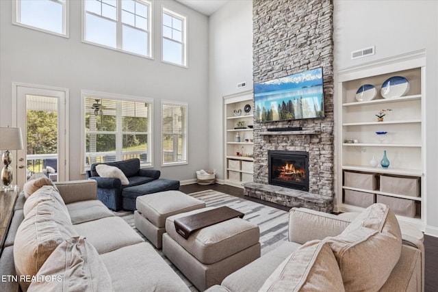 1682 Hickory Reserve Rd, Knoxville, TN 37932 - living room with a towering ceiling, a fireplace, and wood finished floors