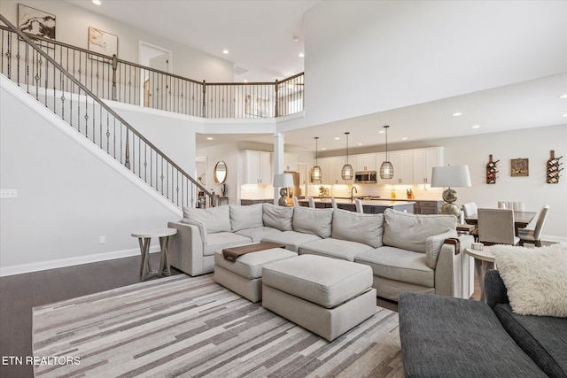 1682 Hickory Reserve Rd, Knoxville, TN 37932 - living area with recessed lighting, light wood-type flooring, a high ceiling, stairs, and ornate columns