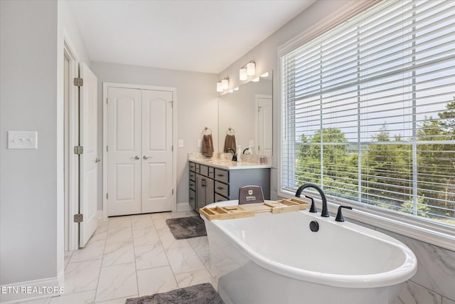 1682 Hickory Reserve Rd, Knoxville, TN 37932 - bathroom featuring marble finish floors, vanity, and a freestanding tub