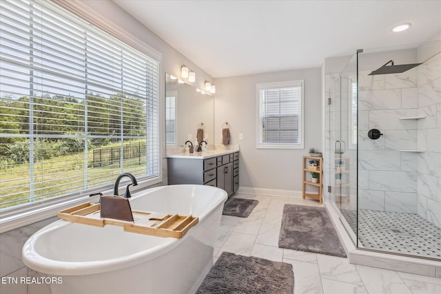 1682 Hickory Reserve Rd, Knoxville, TN 37932 - bathroom featuring marble finish flooring, a shower stall, a soaking tub, and vanity