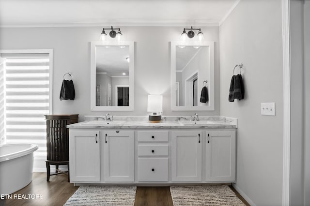 238 Mac Ivey Ln, Lafollette, TN 37766 - bathroom featuring ornamental molding, double vanity, wood finished floors, and a soaking tub