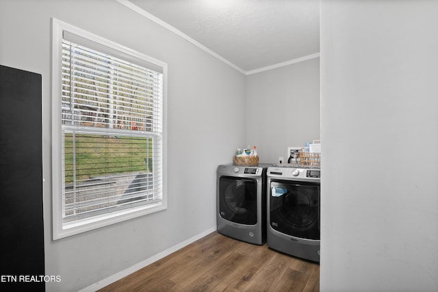 238 Mac Ivey Ln, Lafollette, TN 37766 - laundry area featuring independent washer and dryer, healthy amount of natural light, wood finished floors, and ornamental molding