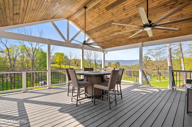 238 Mac Ivey Ln, Lafollette, TN 37766 - wooden terrace with a ceiling fan, outdoor dining space, and a mountain view