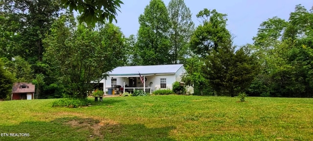 1591 Big Ridge Rd, Spring City, TN 37381 - back of property with a lawn and covered porch