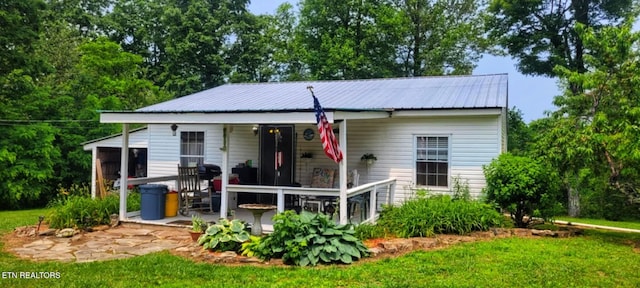 1591 Big Ridge Rd, Spring City, TN 37381 - view of front of house featuring a metal roof, a porch, and a front yard