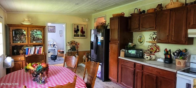 1591 Big Ridge Rd, Spring City, TN 37381 - kitchen with fridge with ice dispenser, white electric range, light wood finished floors, light countertops, and crown molding
