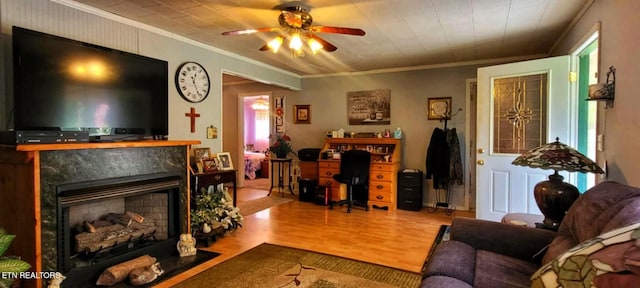 1591 Big Ridge Rd, Spring City, TN 37381 - living area featuring wood finished floors, ornamental molding, a high end fireplace, and a ceiling fan