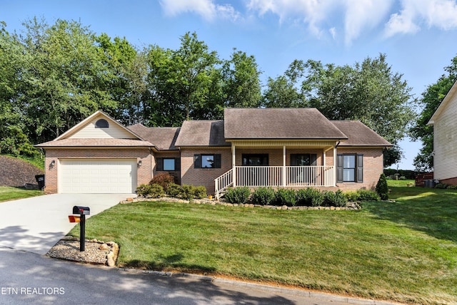 8808 Cedar Springs Ln, Knoxville, TN 37923 - view of front of home featuring brick siding, concrete driveway, an attached garage, and covered porch