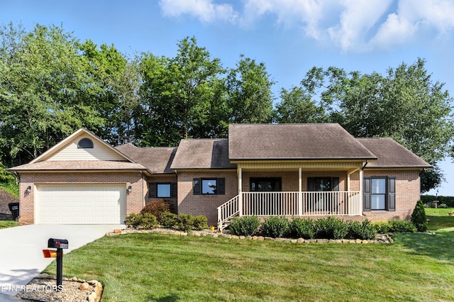 8808 Cedar Springs Ln, Knoxville, TN 37923 - view of front facade featuring brick siding, a porch, an attached garage, a front lawn, and driveway