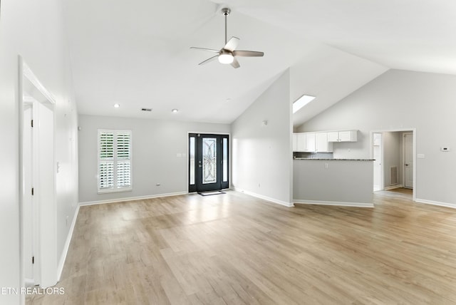 8808 Cedar Springs Ln, Knoxville, TN 37923 - unfurnished living room with high vaulted ceiling, a ceiling fan, and light wood-style floors